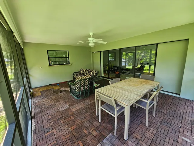 Screened Patio Under ROOF, Could be a Kitchen if converted.