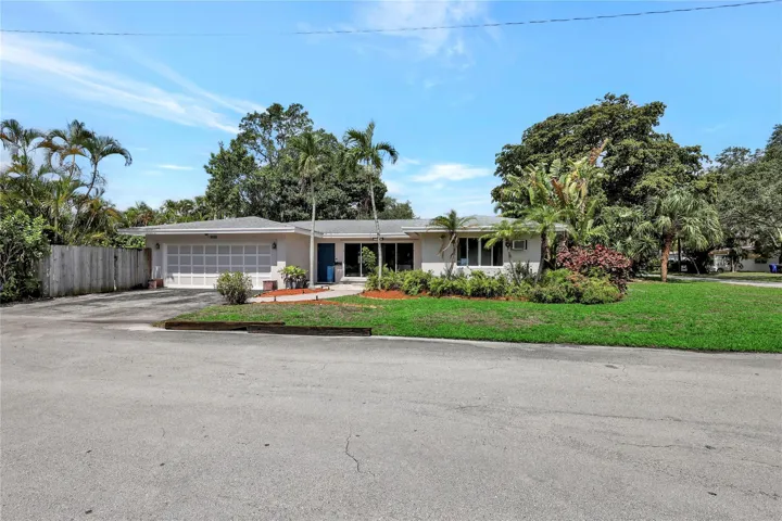 Fort Lauderdale single family home. Brand-new modern kitchen, gorgeous dining and living rooms with Travertine Floors! Newer Roof and 3-ton A/C. Garage has been transformed to hugh family room under air. Leading out to Pool, patio area and then to Huge Yard to enjoy or can be built on and sold, as it has its own Folio number