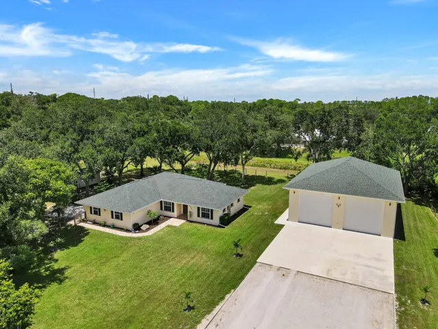 View Of Home and Detached Garage