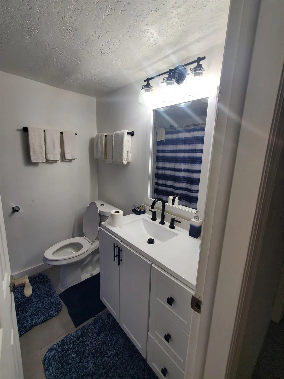 NEW BTHROOM VANITY, TOILET, AND FLOORS