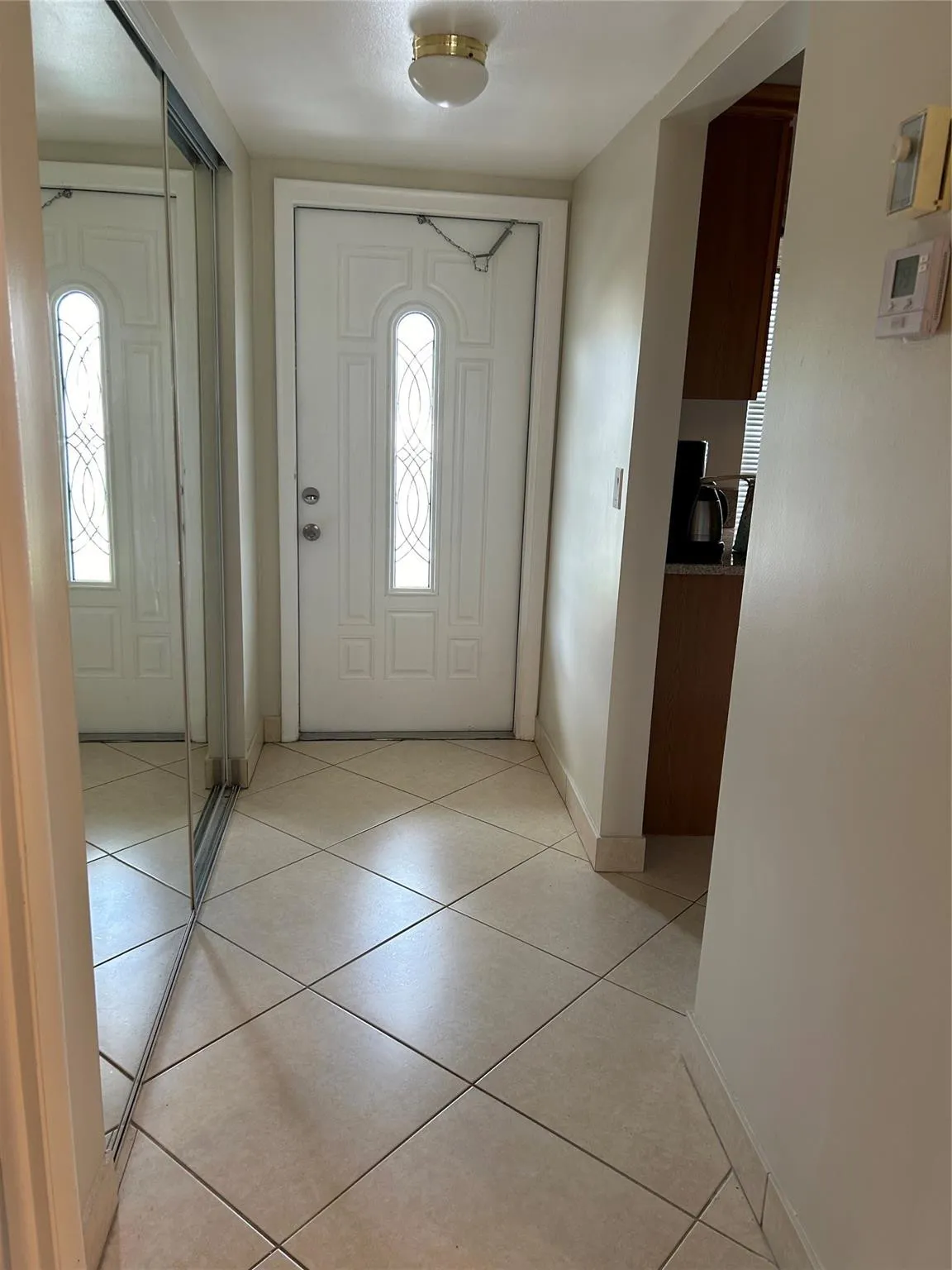 ENTRY - Updated front door, large storage closet.