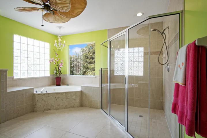Bubble tub, walk in large corner shower.