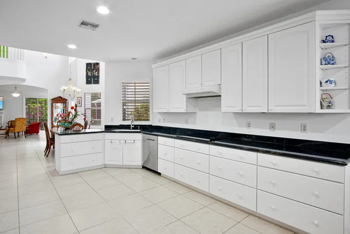 Kitchen with granite countertops . Cooktop, wall oven & microwave.