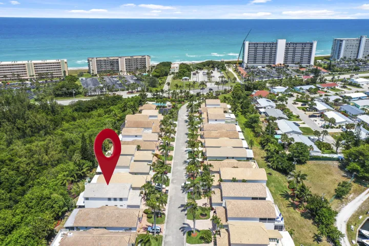 32 single home complex Ocean across A1A . Public beach with life guards, bathrooms and parking.