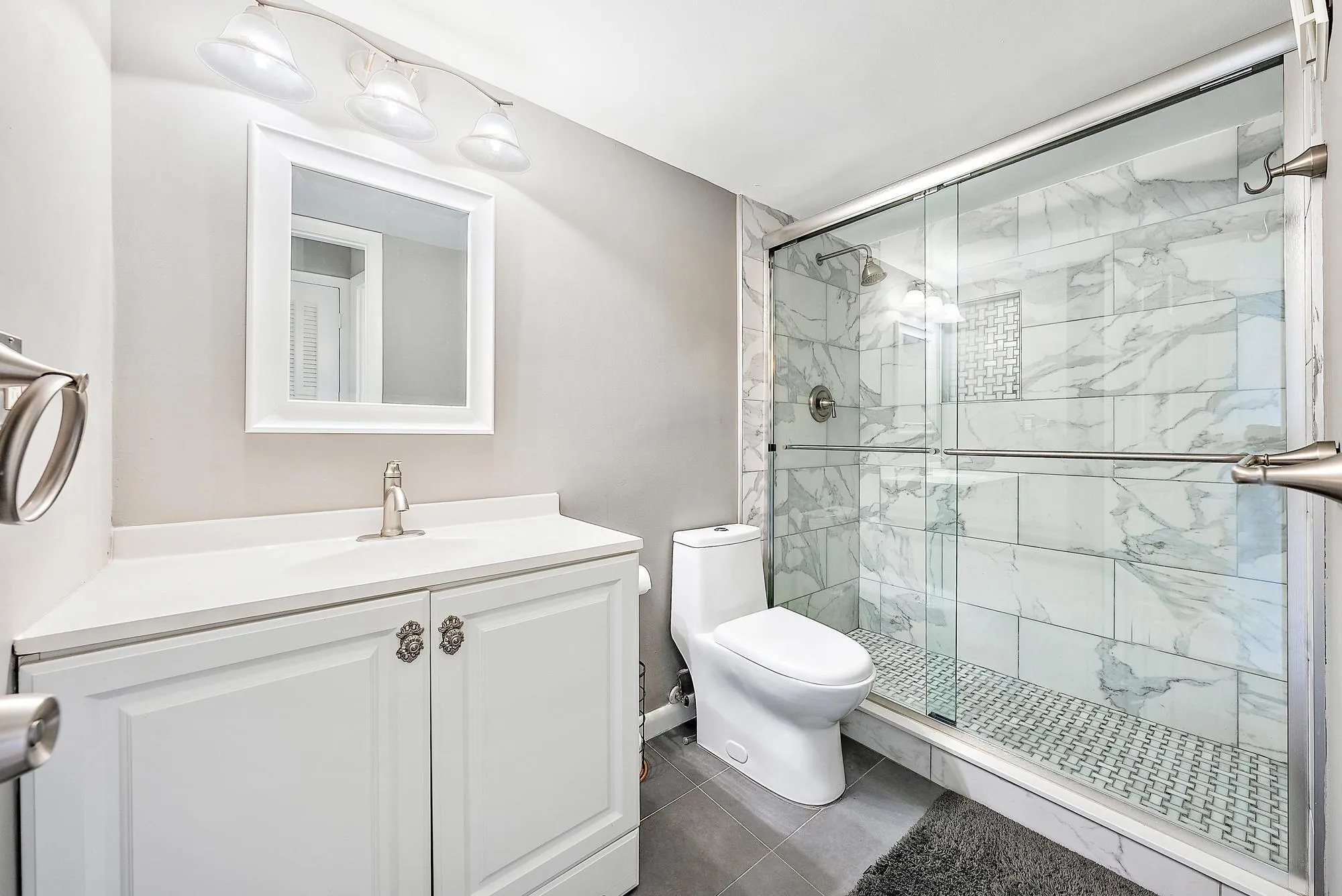 Bathroom with renovated shower.