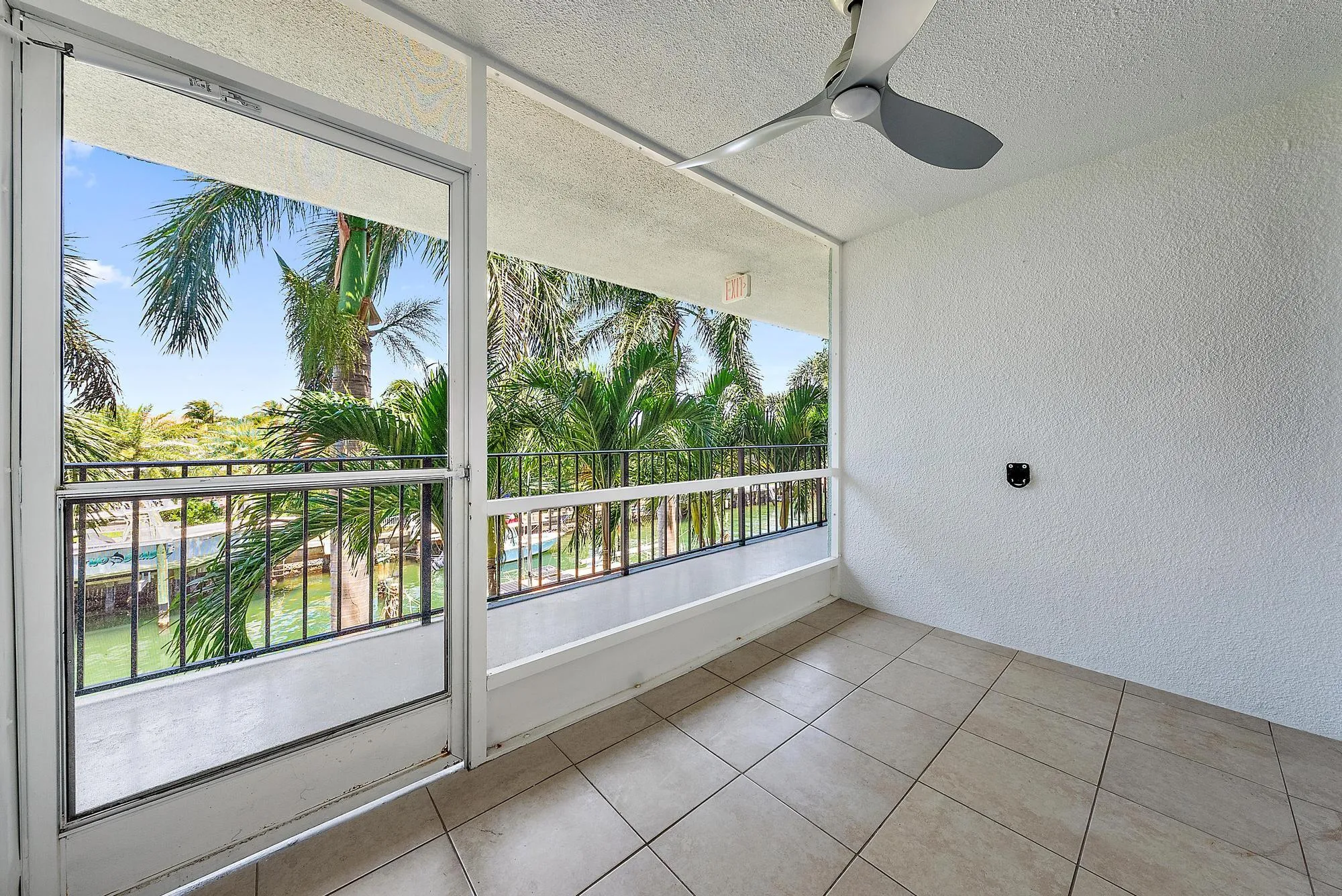 Screened in patio with waterway views.