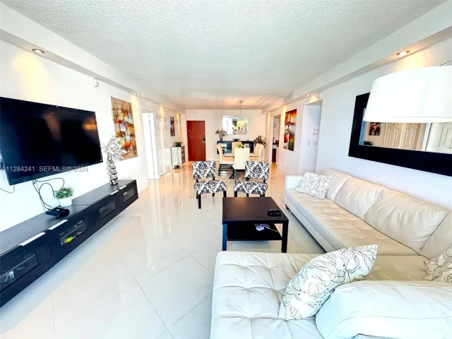 white leather sect sofa, Large Flat TV, upscale furnished