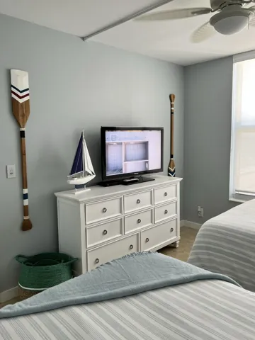 The nautical theme of the guest bedroom is just what you would expect to find in this paradise retreat.