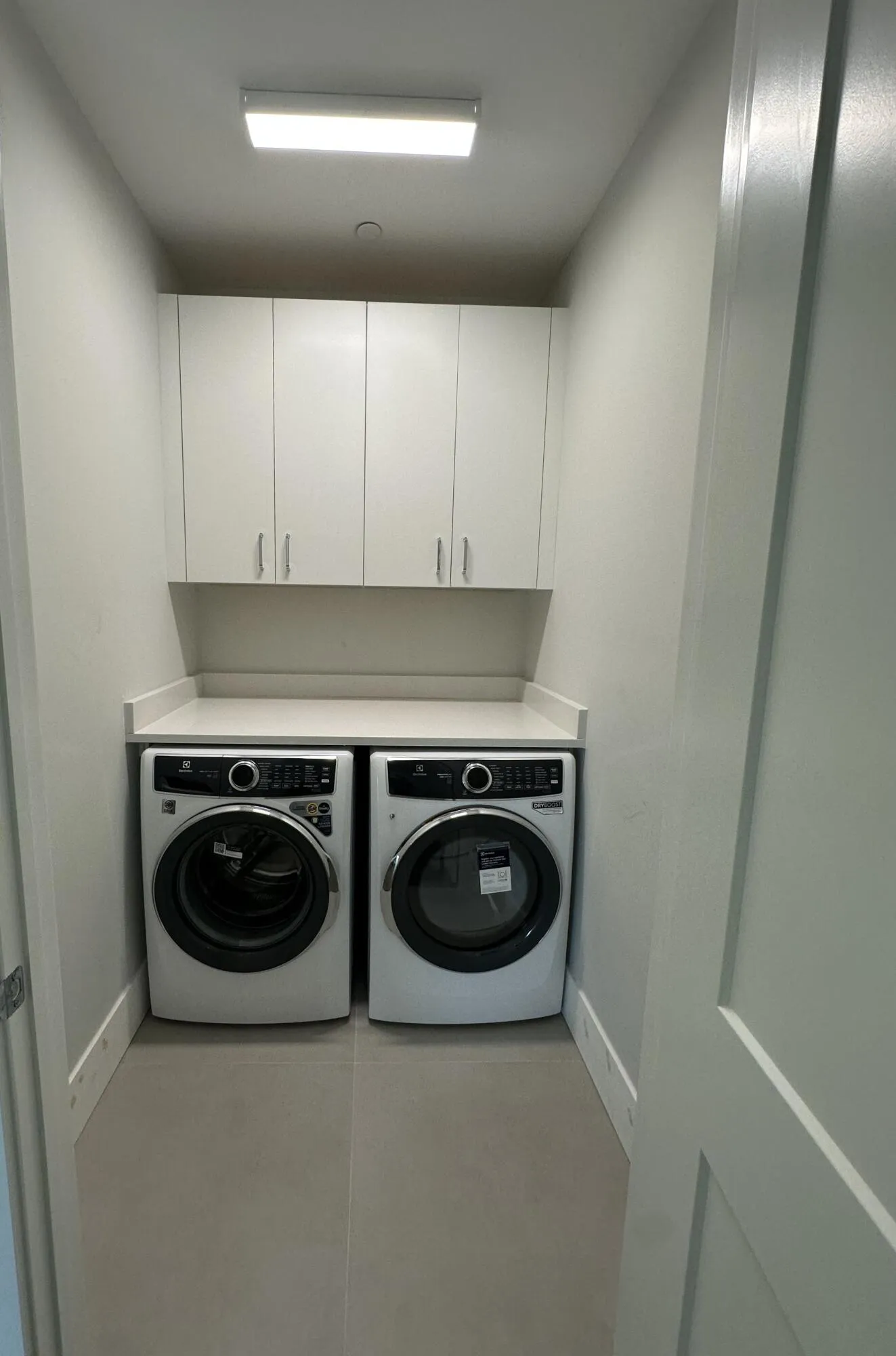 2nd Laundry Room Upstairs with 42" Upper Cabinets and Quartz Countertop!