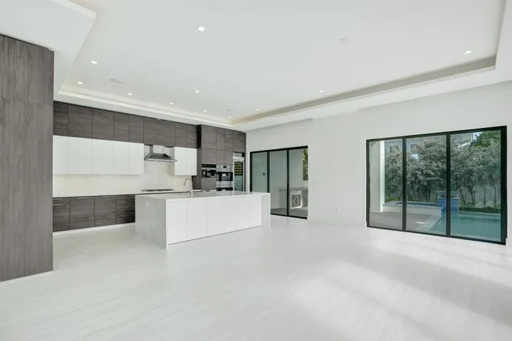 Open-Concept Kitchen Flowing into Dining and Living Areas.