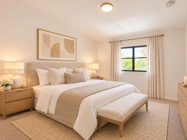 Neutral-toned wall finish, carpeted flooring, and a single-pane window with a black frame