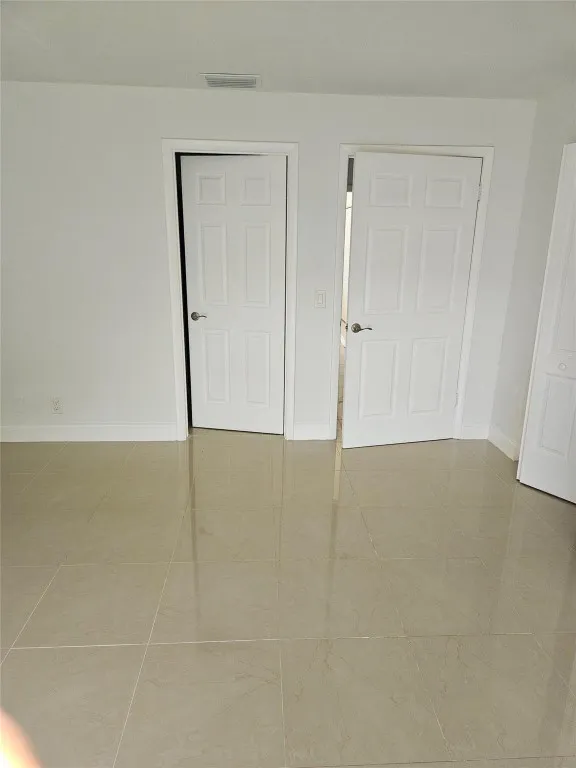 Primary Bedroom/Exit and Bathroom Door