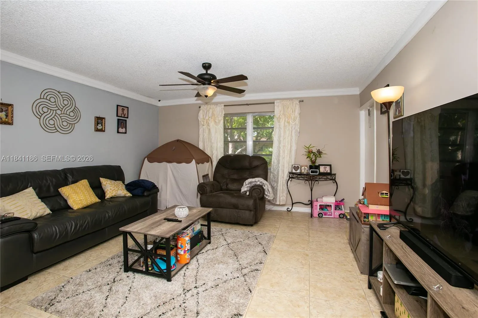 LIVING ROOM W/CROWN MOLDING