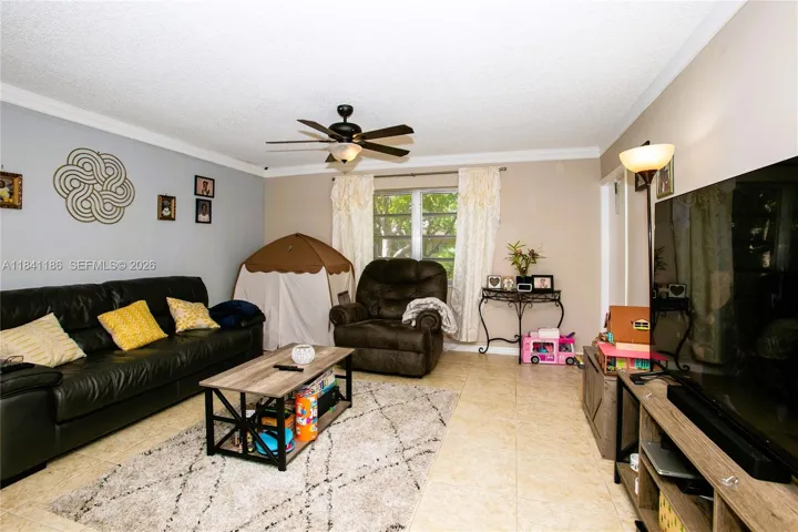 Spacious Living Room w/Door To Patio & Water Views