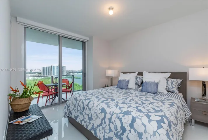 Master Bedroom - Features the same beautiful view. Electric blackout with side guides for complete darkness, plus roller shades.