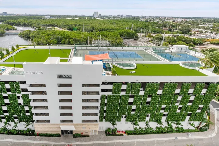 The parking garage building. On the rooftop there is a tennis court, half basketball court, kids playground, a soccer field and BBQ Area