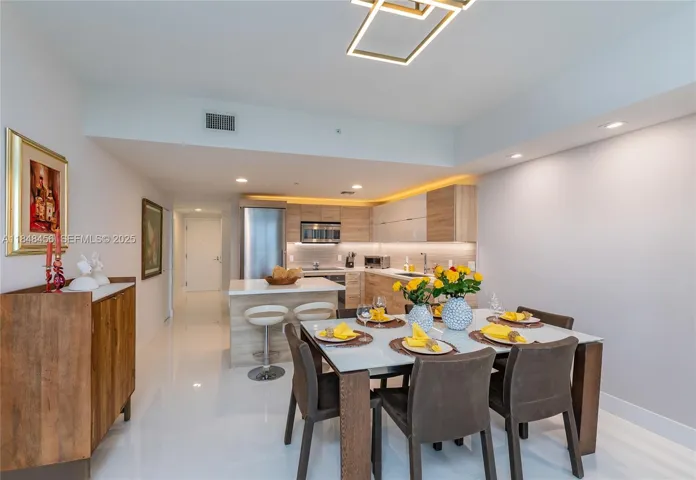 Another view of the dining and kitchen