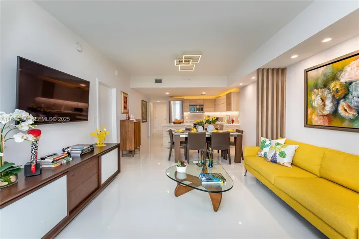 All Social area and kitchen. Notice there is a decorative column built to define the spaces between the dining and living room.