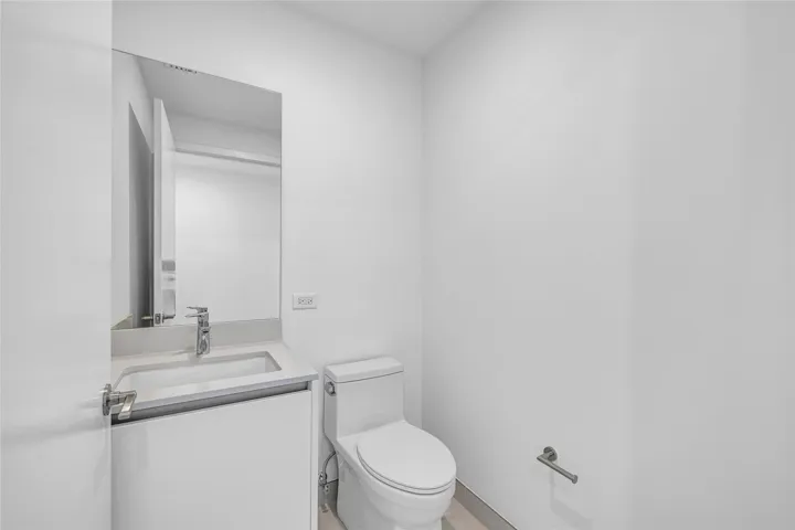 Powder Room located in the Foyer Entry