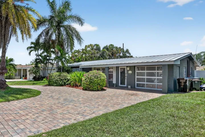 Beautiful curb appeal with oversized circular paver driveway