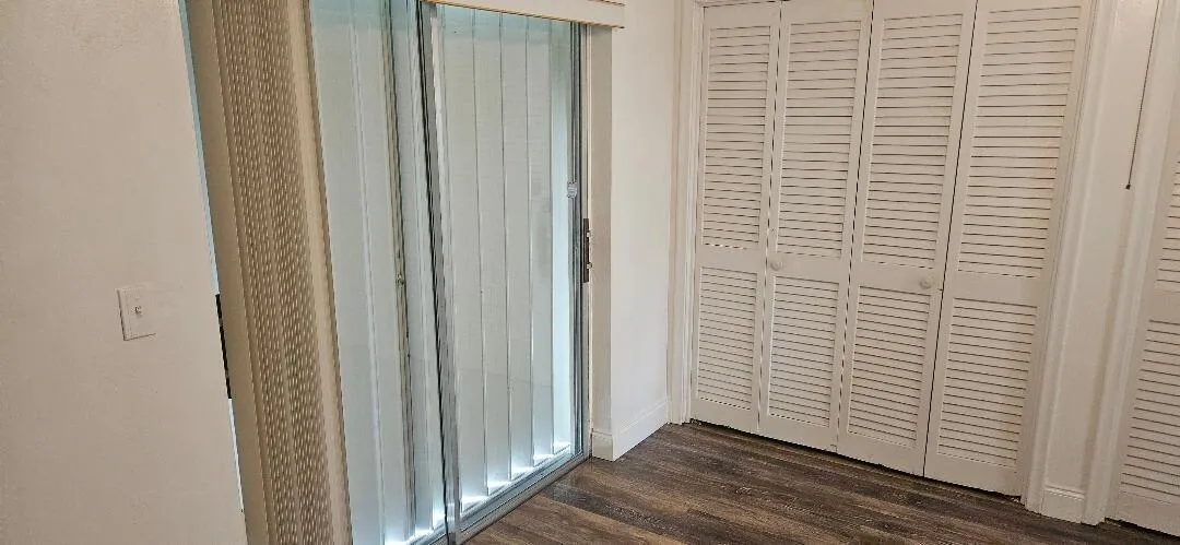 bedroom with wall to wall closets