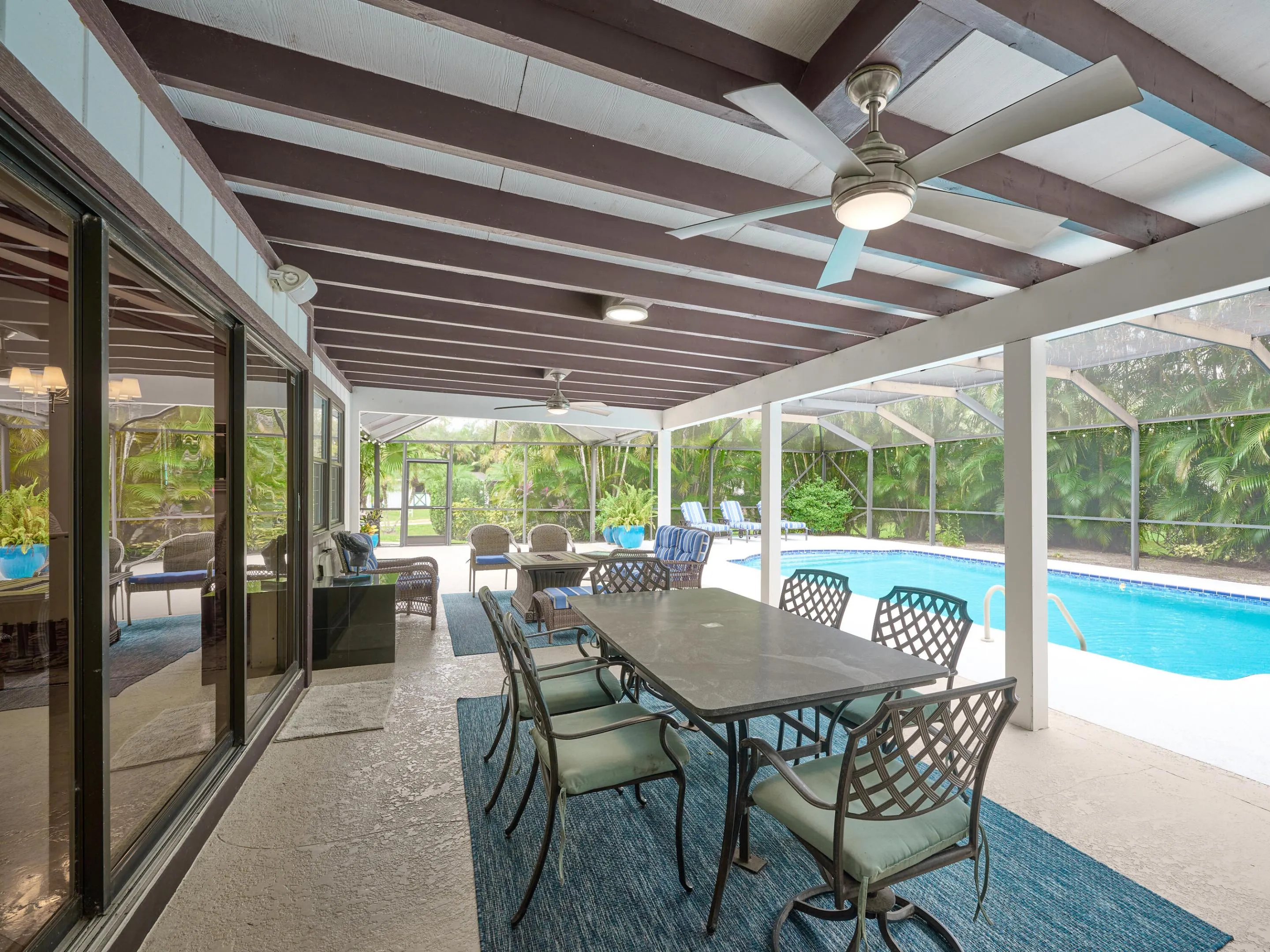 Screen-enclosed pool for relaxing after a day of riding.