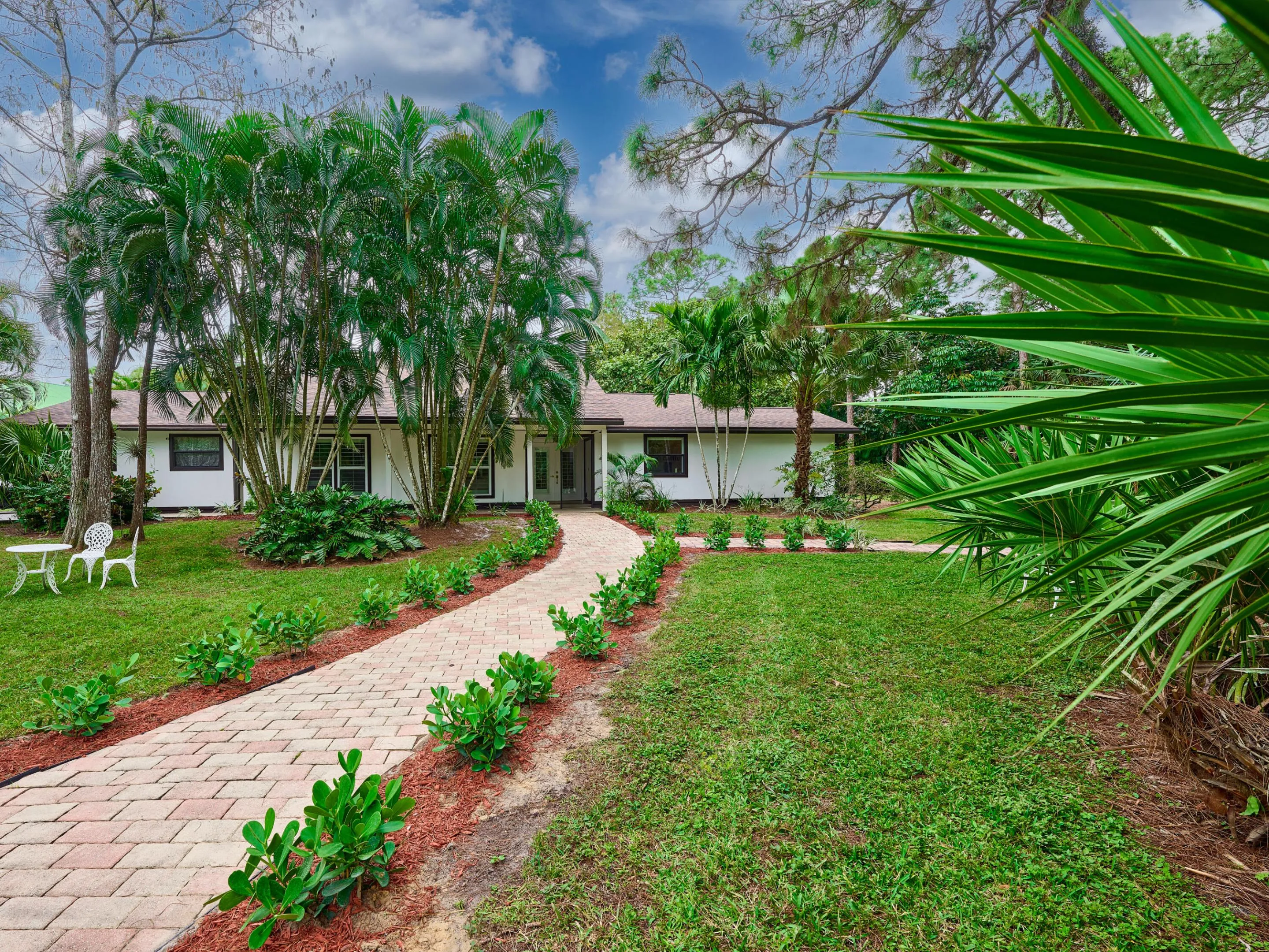 Landscaped walkway to the home's front entry way