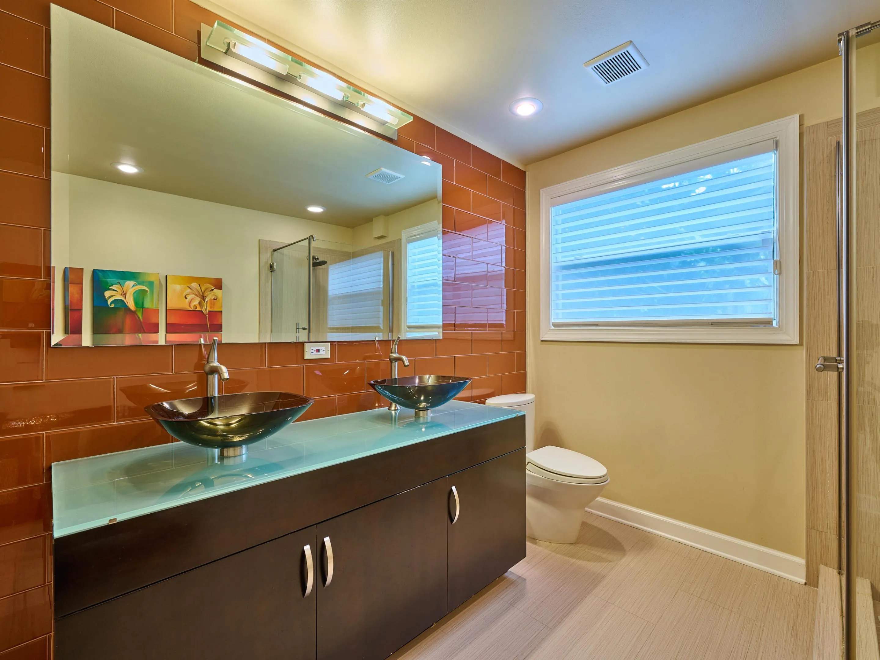 Boasting dual sinks and contemporary decor.