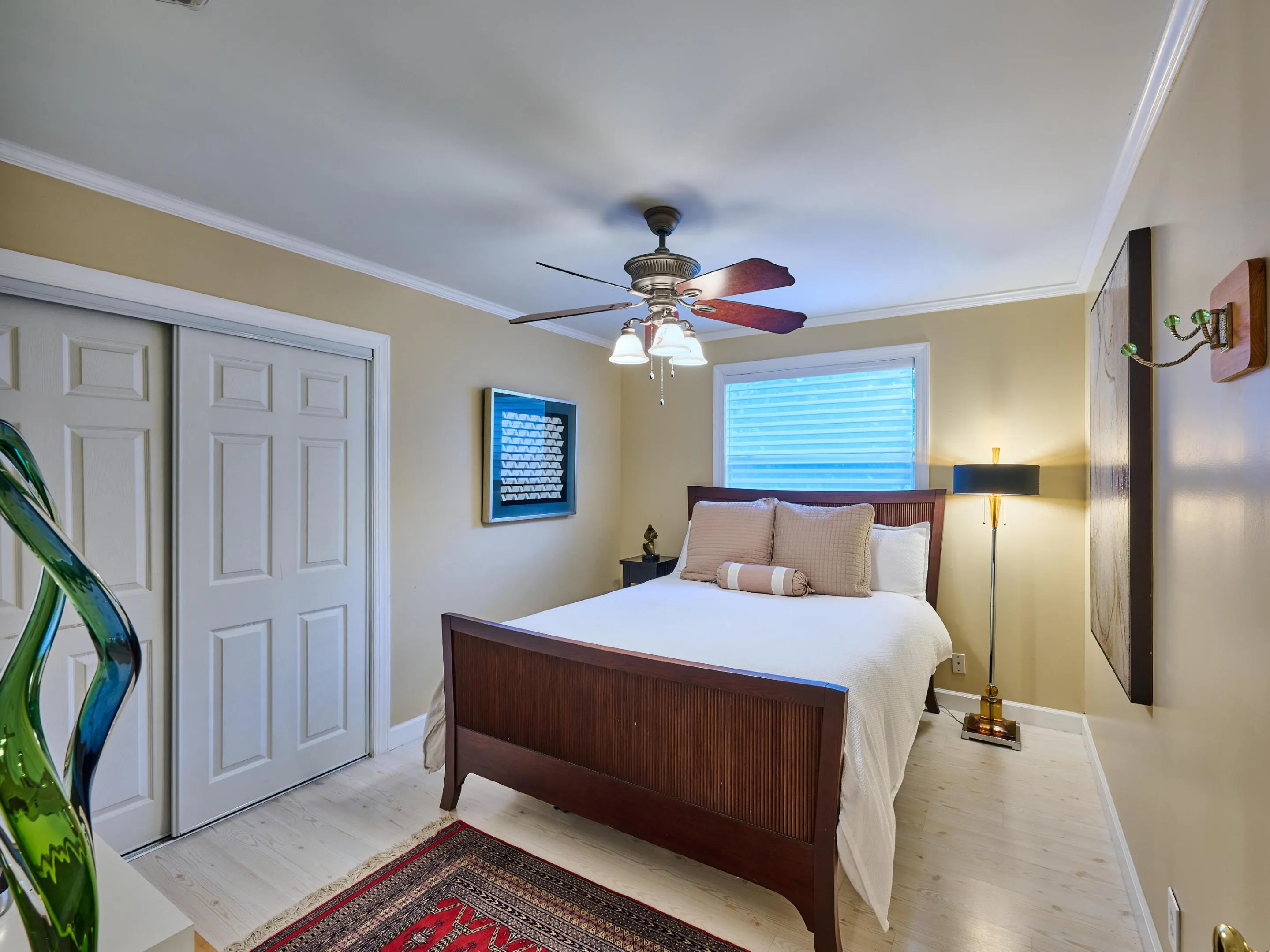 Guest bedroom, very spacious, crown molded with ample closet space.