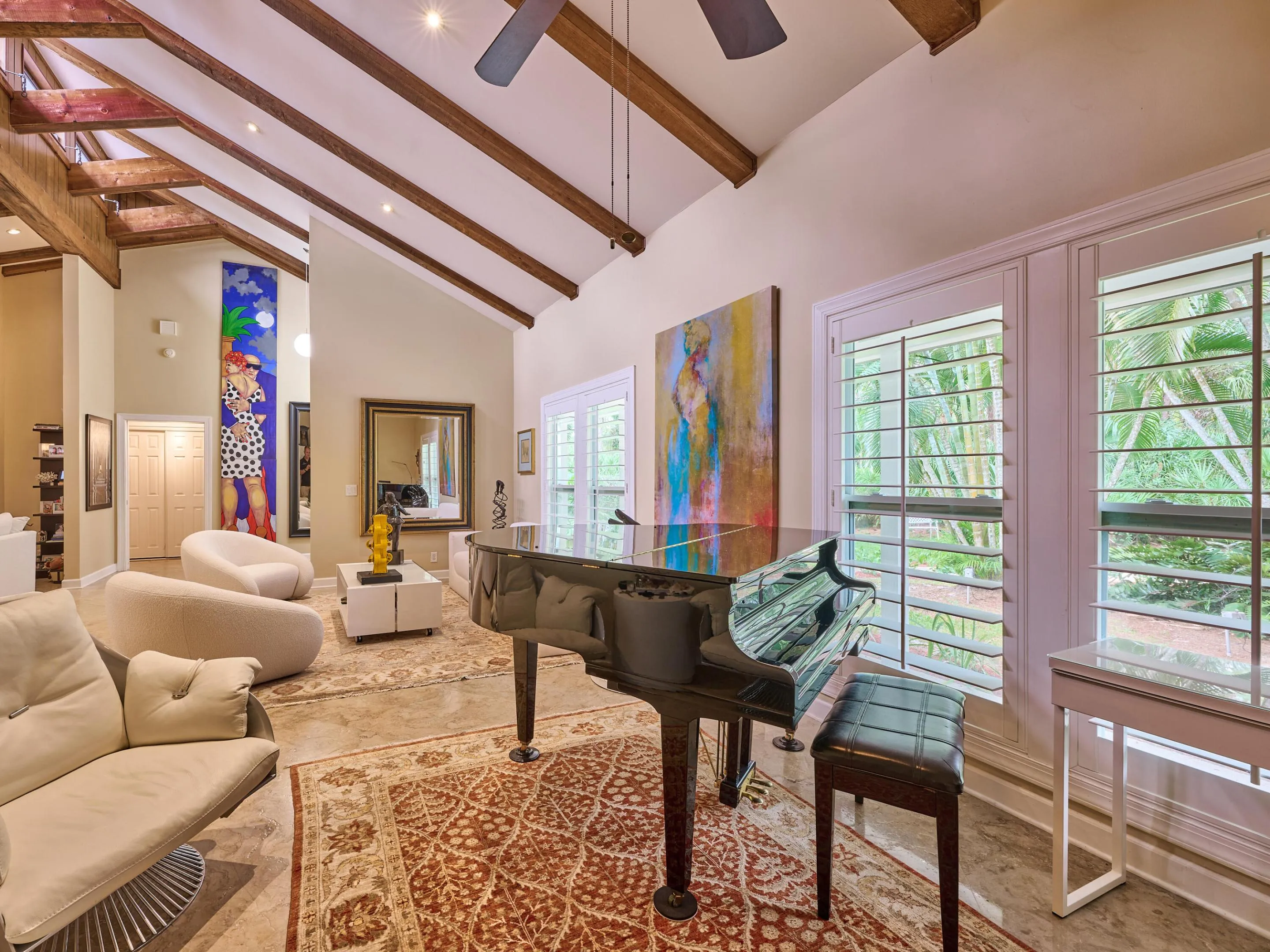 This spacious home is bathed in nature from all of the window openings.