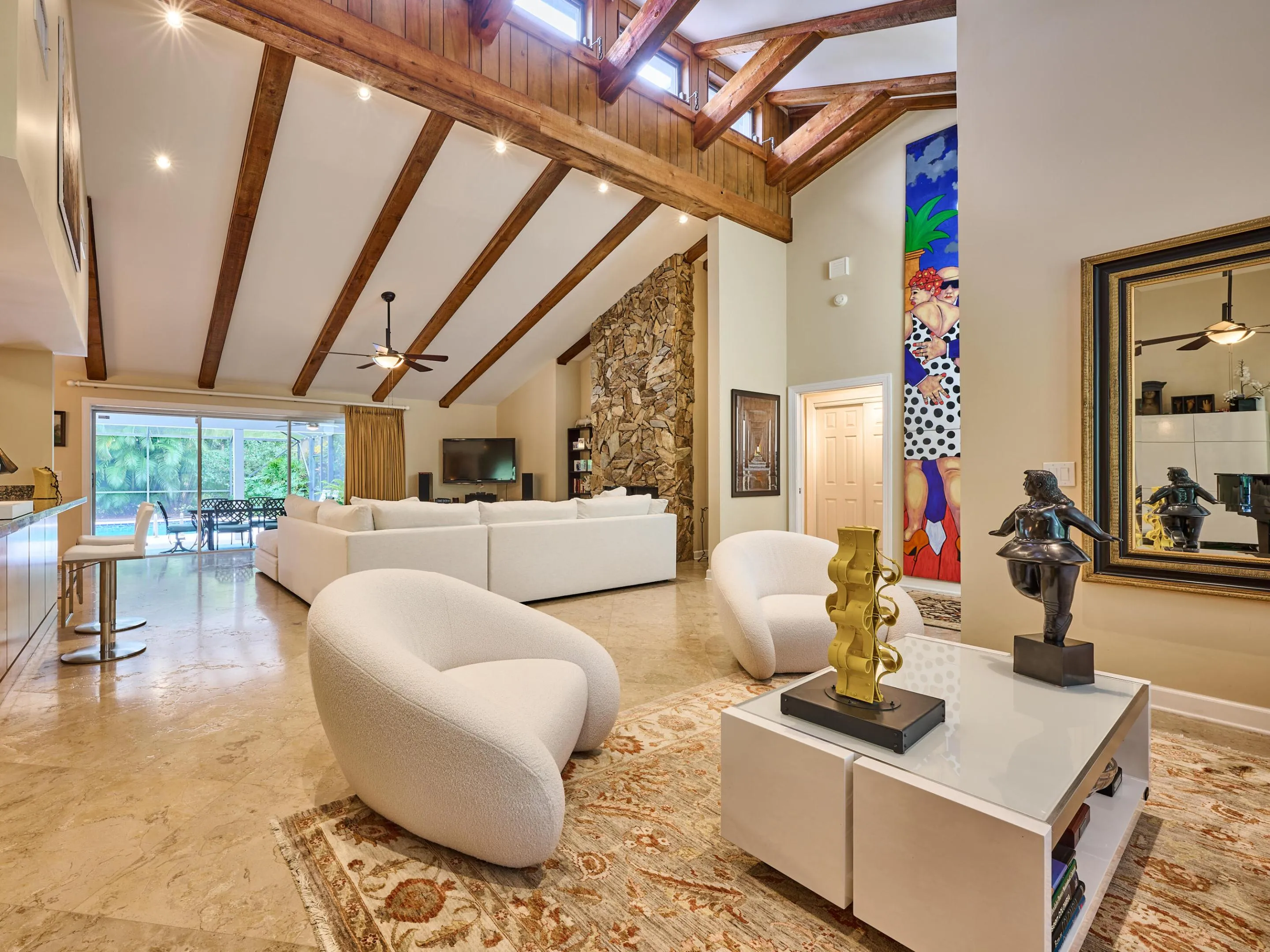 The formal space melts into the informal space to enjoy TV or conversing with the chef.