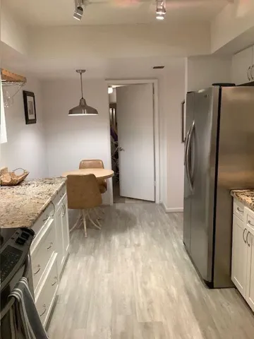 The utility/Washer/Dryer closet is convenient to the kitchen area