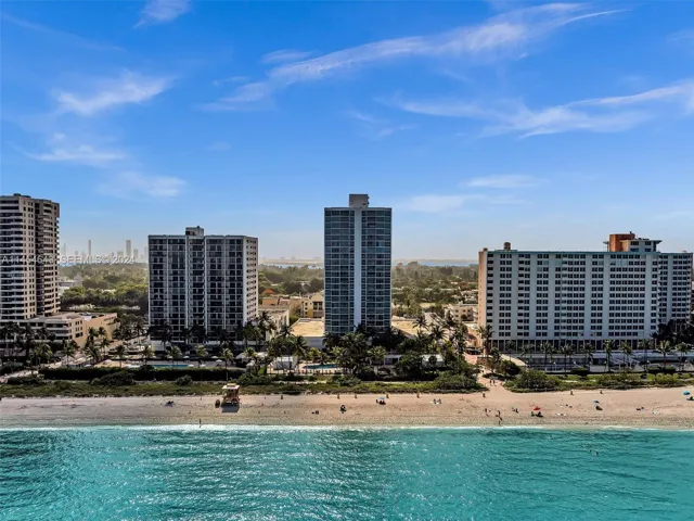 Oceanfront building, pool and boardwalk
