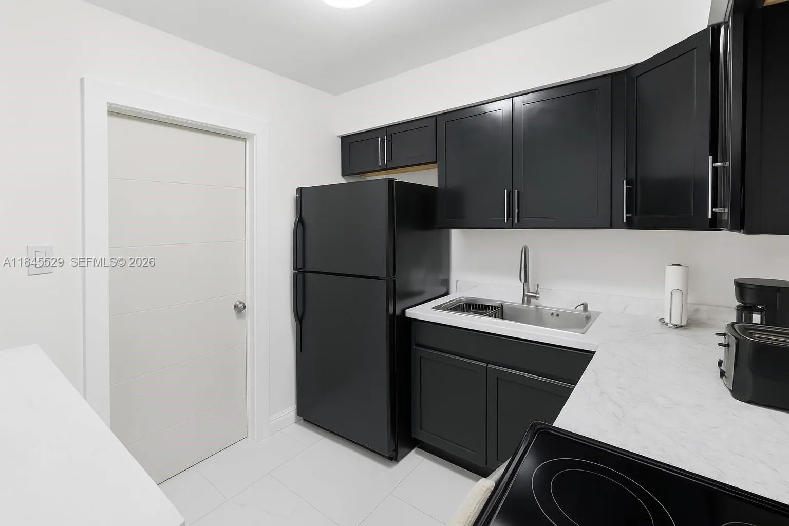 Well designed kitchen space with newer counter top