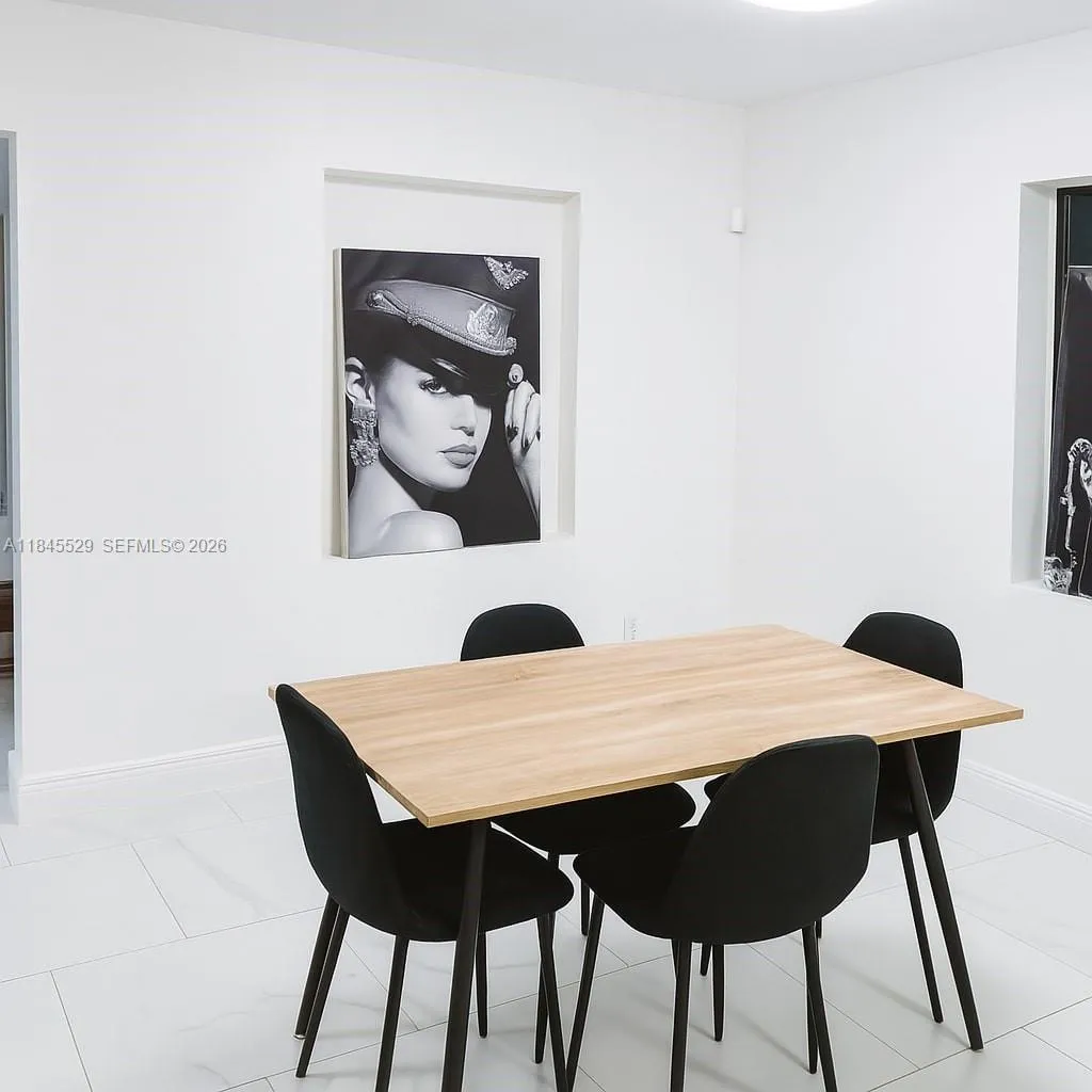 Dining area, smooth walls finish, & windows provide natural light in dining area