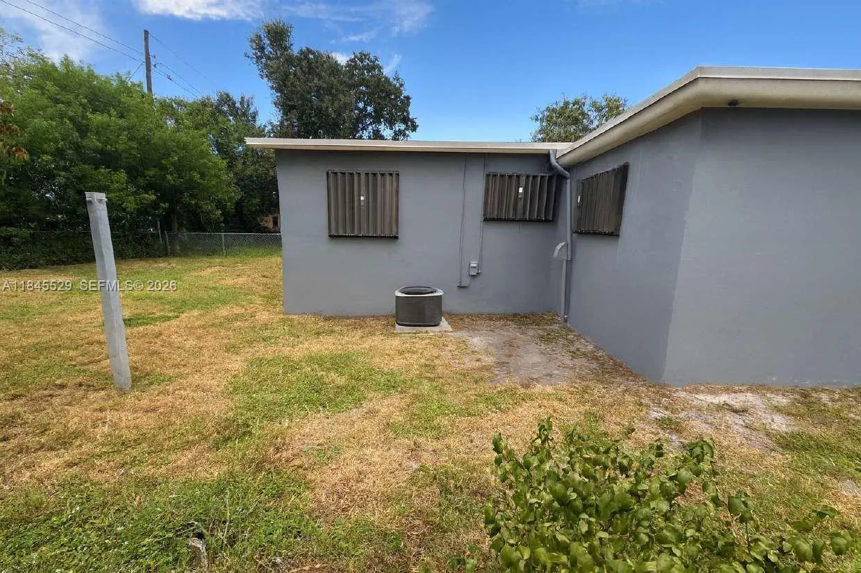Spacious backyard space & air condenser unit