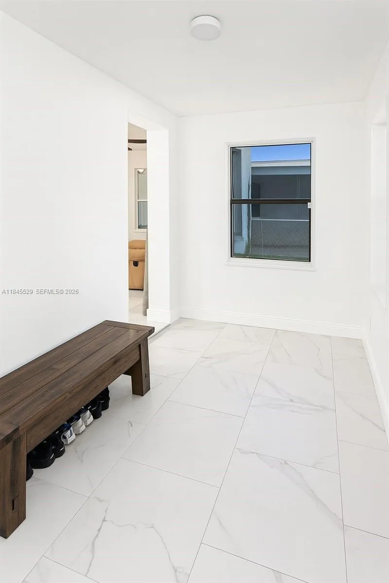 Florida room with 2 windows offers plentiful natural light