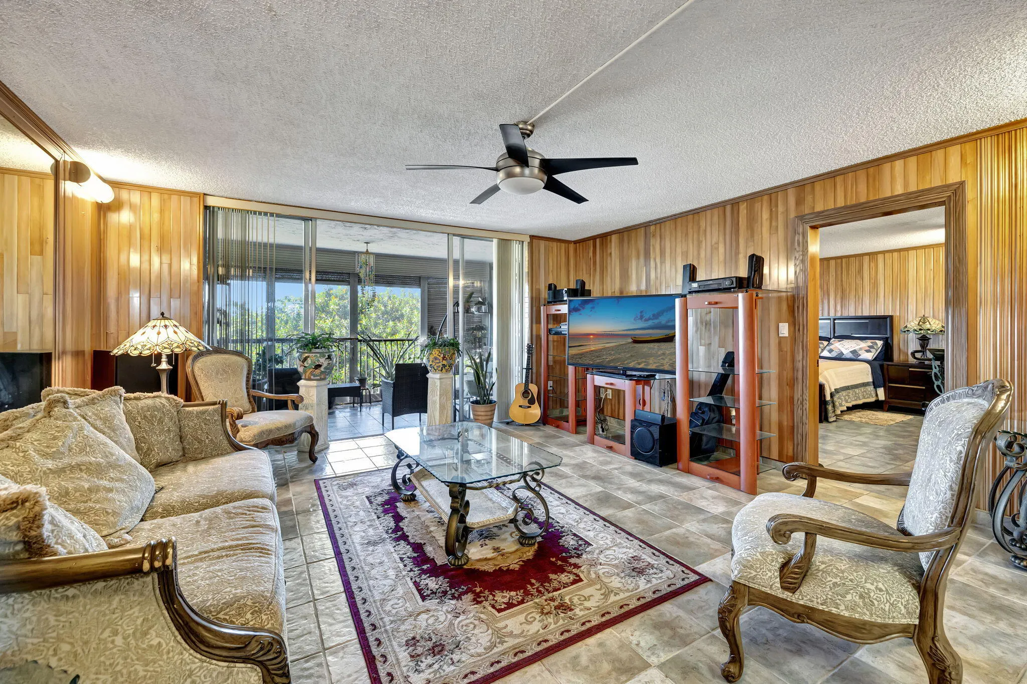 LIVINGROOM WITH VIEW OF BALCONY AND MASTER BEDROOM