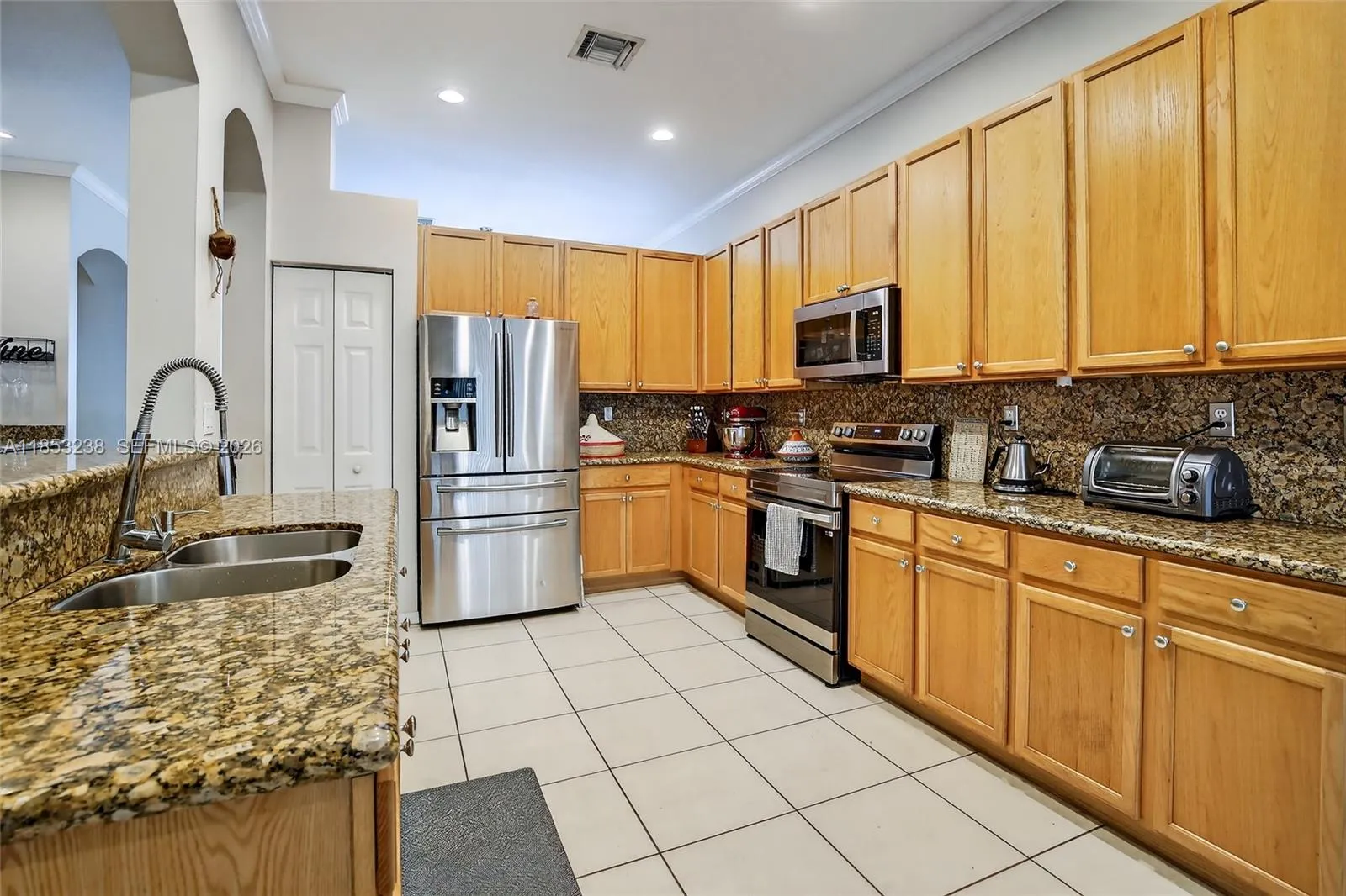 Kitchen with granite counter tops & newer appliances