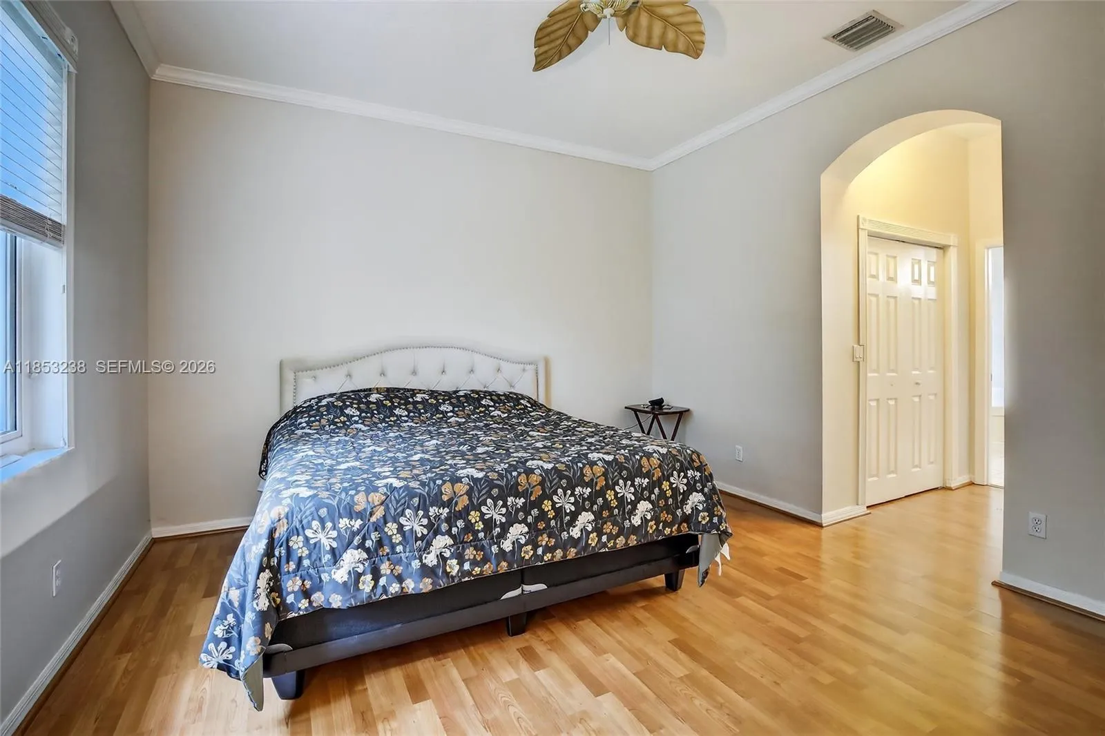 Spacious primary bedroom - hallway to his/her closets