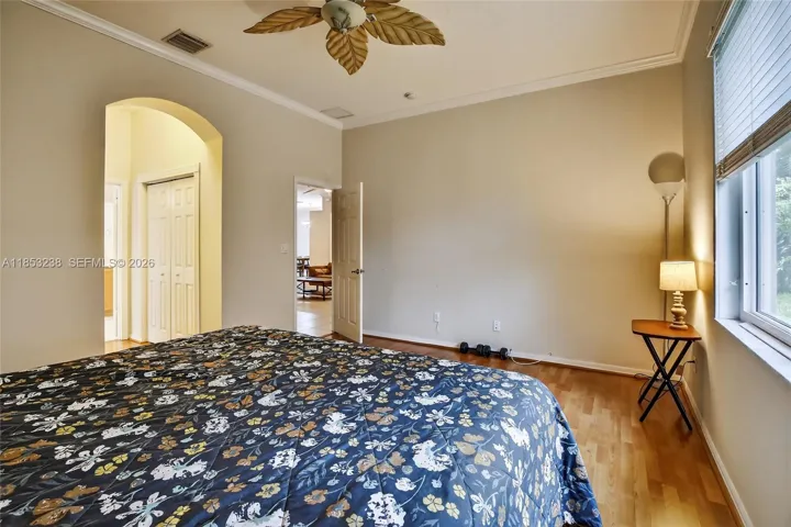 Spacious primary bedroom - hallway to his/her closets