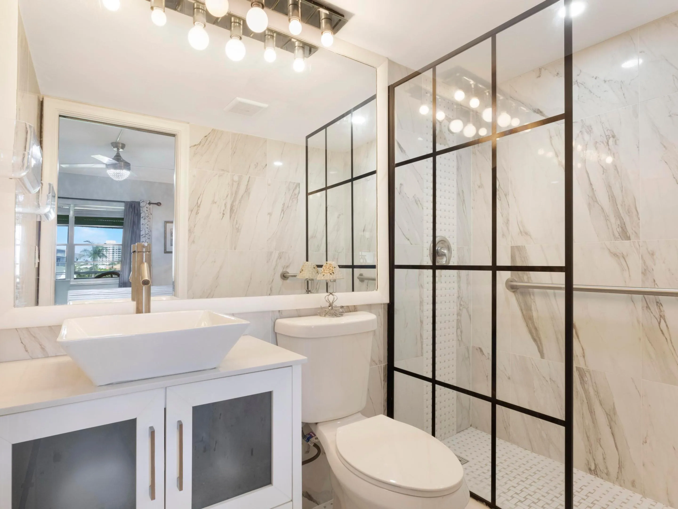 Renovated primary bathroom with sleek, walk-in shower