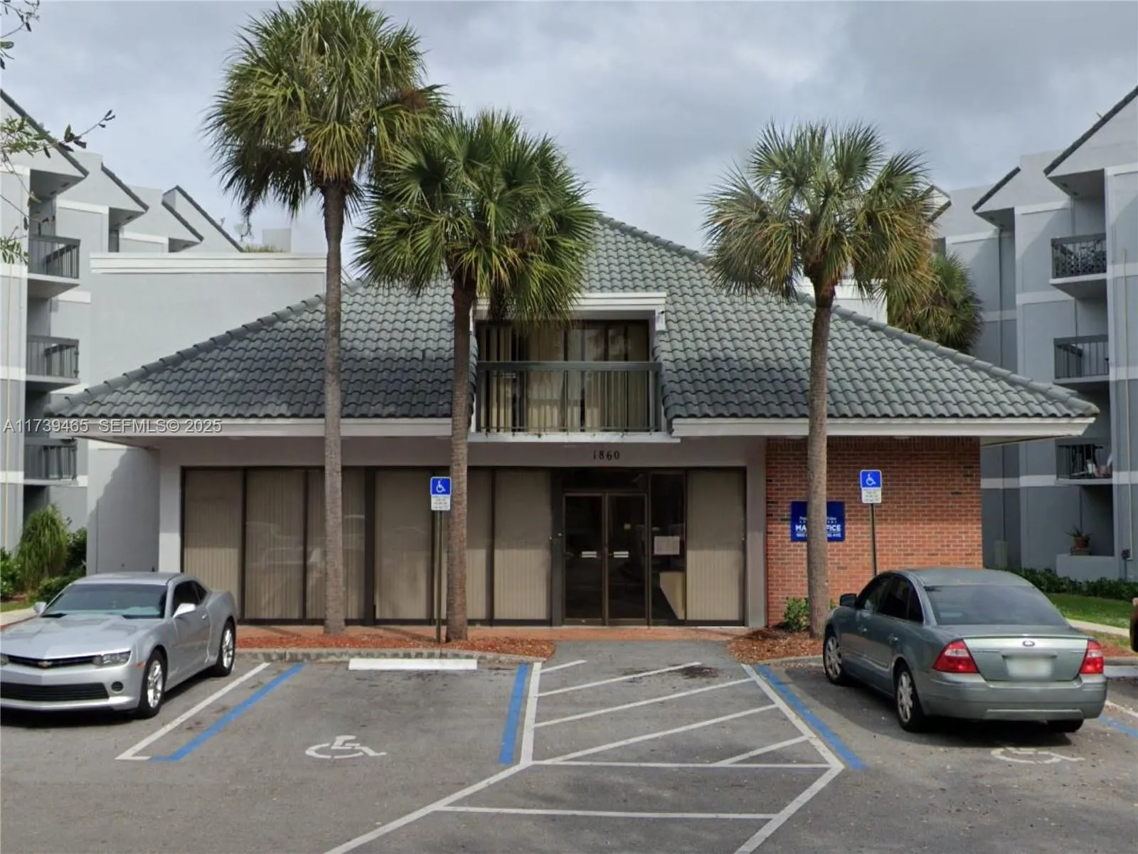Clubhouse which is located in front of pool.