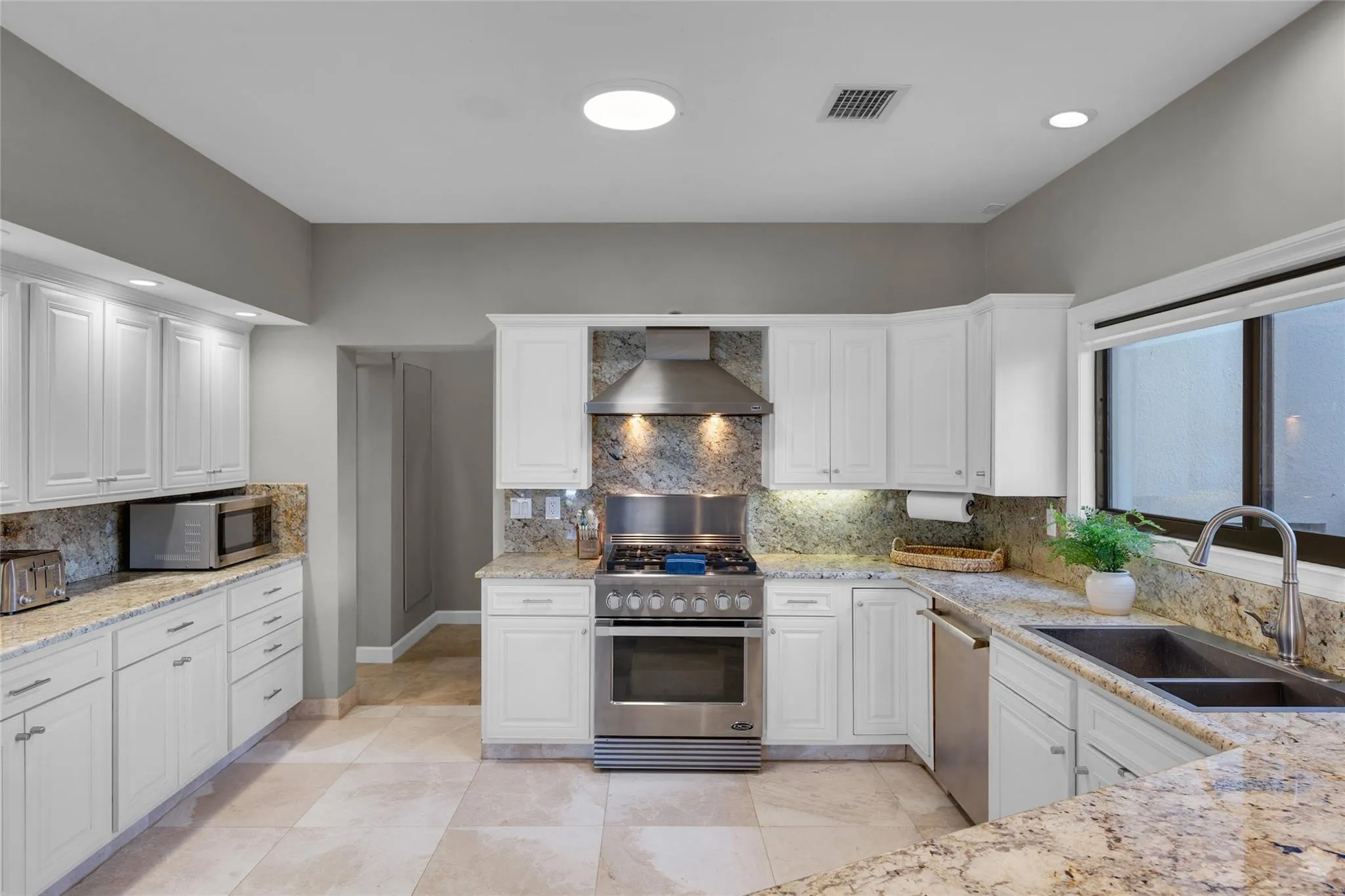 Beautiful chef's kitchen with stainless steel appliances