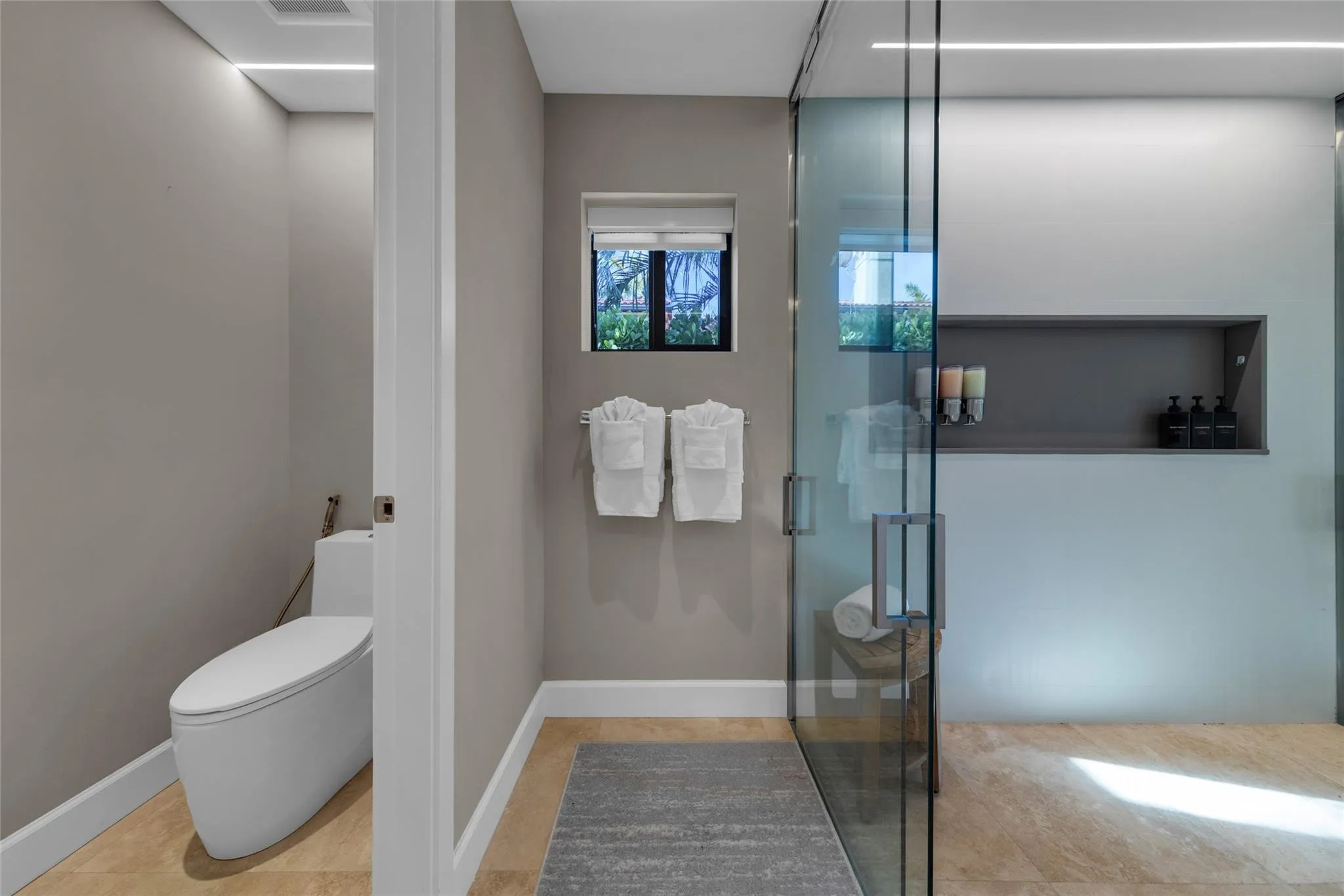 Primary Bathroom with 2 Toilet Closets, Dual Shower and Dual Sinks.