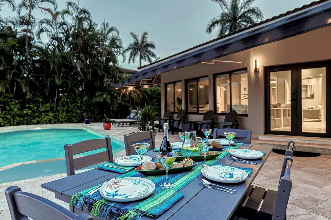 Waterfront pool and outdoor dining area