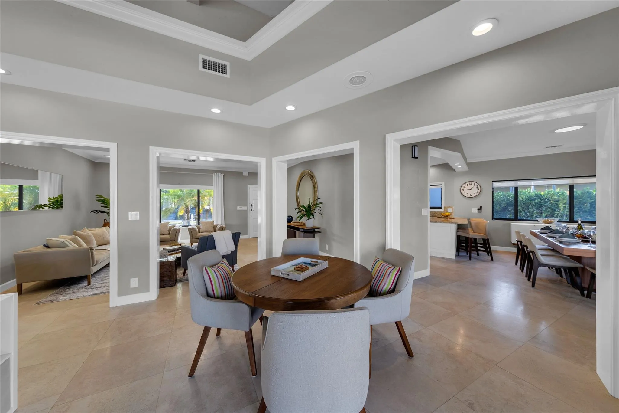 Open floor family room with large windows and patio access
