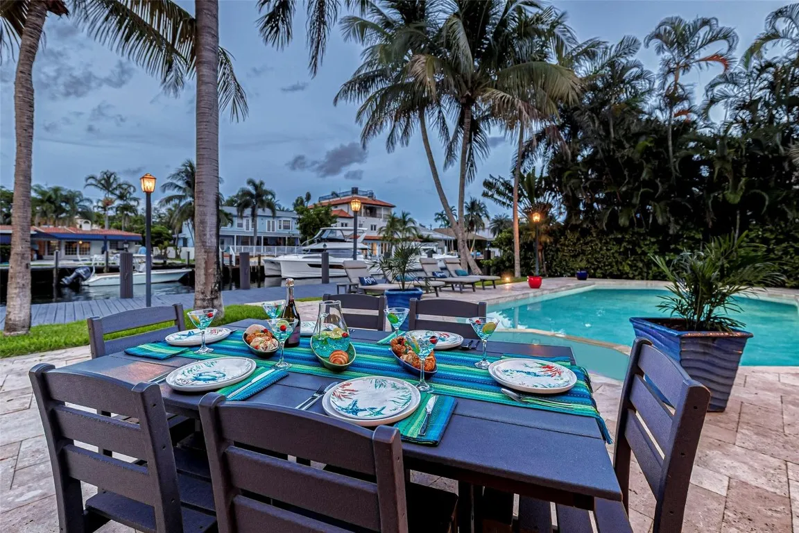 Waterfront pool and outdoor dining area