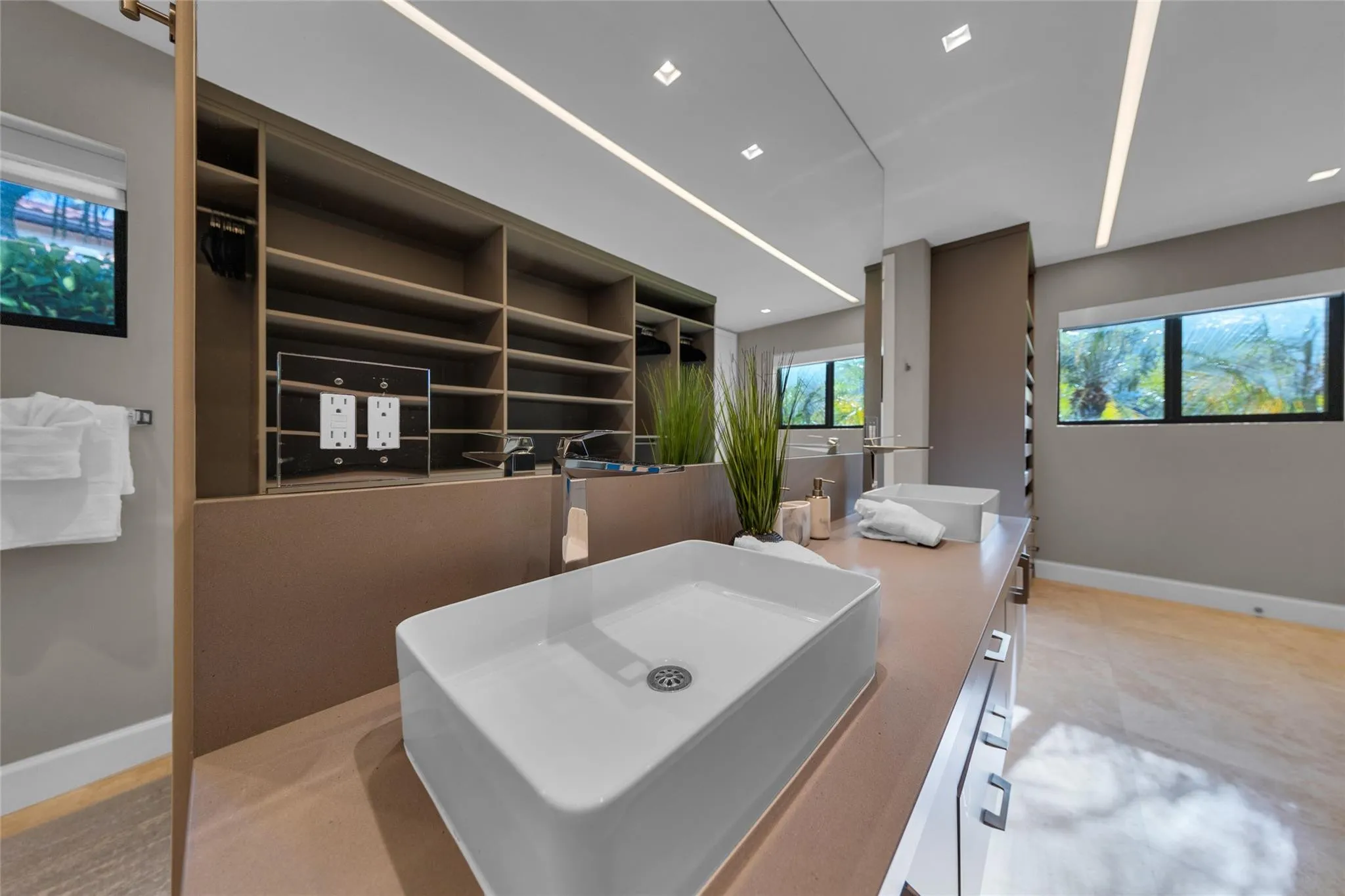 Primary Bathroom with 2 Toilet Closets, Dual Shower and Dual Sinks.