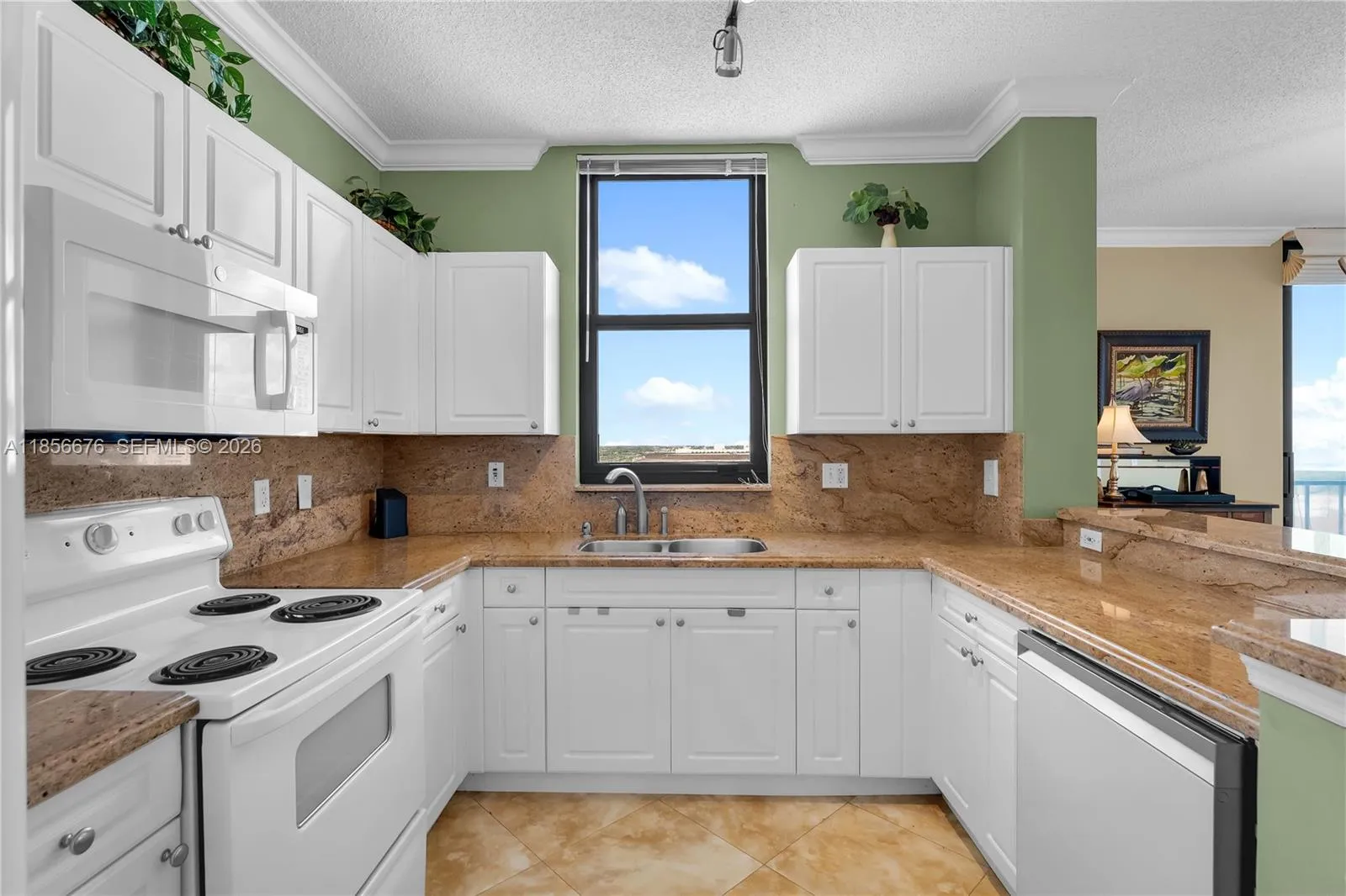 Open Kitchen with updated cabinetry and matching appliances. Washer and Dryer inside the unit as well!651 Okeechobee Blvd., Unit #1002, West Palm Beach, FL. City Place Tower Condominium. For Sale.